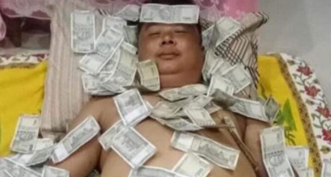 Photo of Assam politician sleeping on pile of cash stirs row, BJP ally clarifies