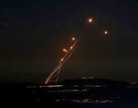 Iran fires nearly 200 missiles into Israel; Israel vows retaliation ‘at place and time we decide’