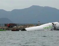 Cargo aircraft skids off Hong Kong runway into sea, killing two people