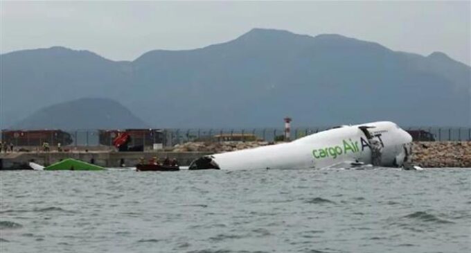 Cargo aircraft skids off Hong Kong runway into sea, killing two people